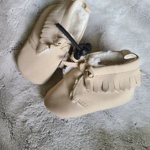 Unisex neutral Size 2 never worn beige mocasins.